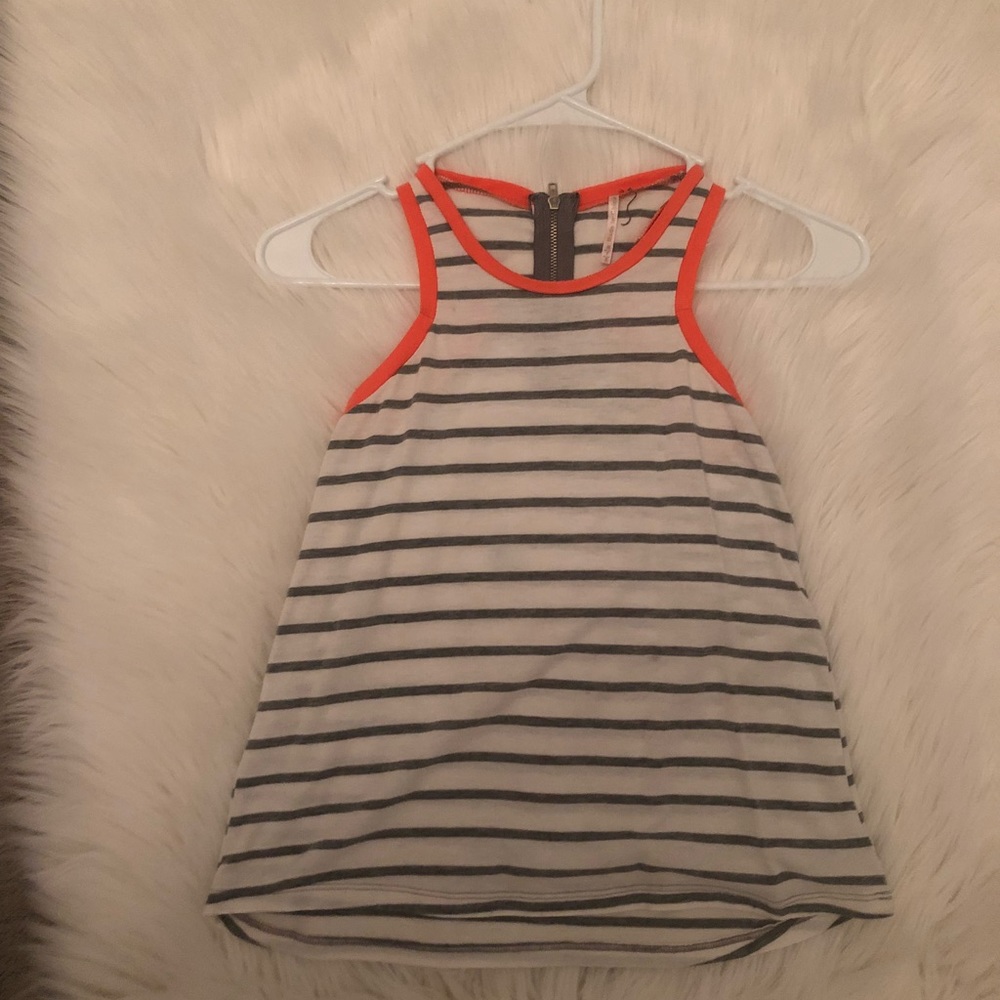 I am selling a white trendy thick strap tank top.